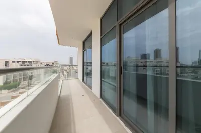 an empty balcony of a building with glass windows at Splendid 1BR in Living Garden in Dubai