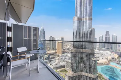 a balcony with a table and a view of a city at Address Dubai Opera Residences by The S Holiday Homes in Dubai