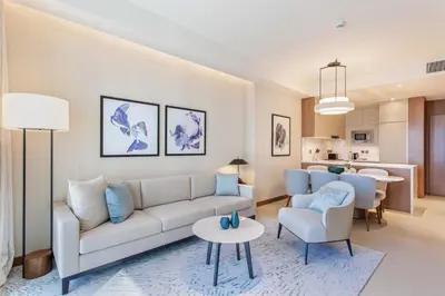 a living room with a couch and chairs and a table at Address Dubai Opera Residences by The S Holiday Homes in Dubai