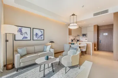 a living room with a couch and chairs and a table at Address Dubai Opera Residences by The S Holiday Homes in Dubai