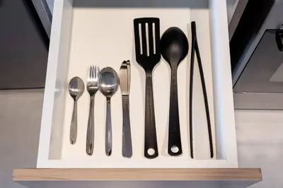 a group of utensils in a white box at Peacefull Studio - Arjan in Dubai
