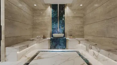 a marble bathroom with a sink and a tub at Stonetree - Brand New Studio - Prime Location in Dubai