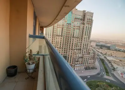 a balcony in a building with a view of a city at Ideal for Families Close to ALL Amenities in Dubai