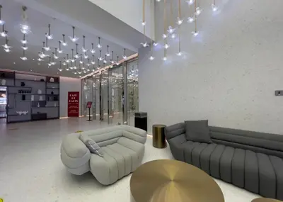 a living room with two couches and a table at City Retreat MAG 318,Downtown Dubai 5 minutes walk to Dubai mall in Dubai