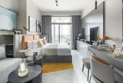 a hotel room with a bed and a living room at City Retreat MAG 318,Downtown Dubai 5 minutes walk to Dubai mall in Dubai