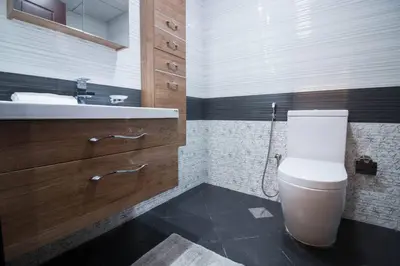 a bathroom with a toilet and a sink at Furnished Studio Ready to Move-in in Dubai