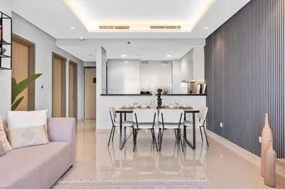 a kitchen and dining room with a table and chairs at Luxury Stay with Burj Khalifa Views & Infinity Pool in Dubai