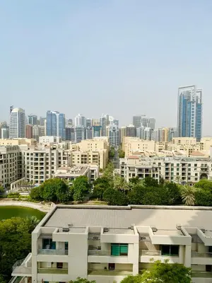 a view of a city with tall buildings at Greens in Dubai