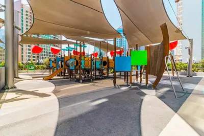 a playground with colorful tables and chairs in a city at Elegant MAG 318 Studio Near Dubai Mall in Dubai