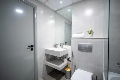 a bathroom with a sink and a toilet and a shower at Dubai marina - Luxury Studio Apartment in Dubai