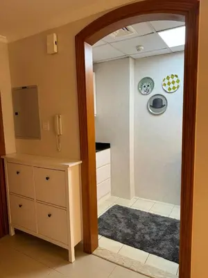 a bathroom with a walk in shower next to a kitchen at Great Location in Dubai Marina!! in Dubai