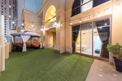 a room with a green floor in a building at ELAN RIMAL MURJAN Suites in Dubai
