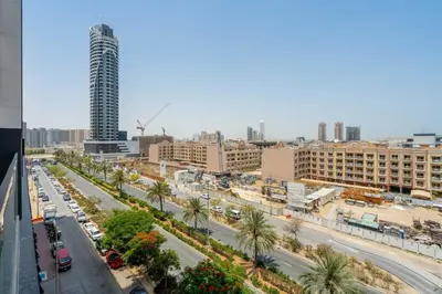 an aerial view of a city street with a tall building at GuestReady - Charming haven at Binghatti Crest in Dubai