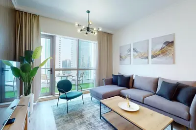 a living room with a couch and a table at Bay Central - Enticing Two Bedroom in Dubai