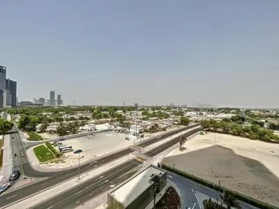 an aerial view of a city with a highway at Downtown Views II, Tower 2- Calm One Bedroom in Dubai