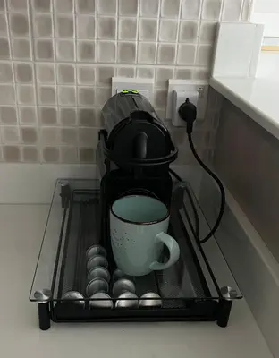 a coffee maker sitting on a rack in a kitchen at SevenPalm 2BR SeaView RooftopPool privBeach in Dubai