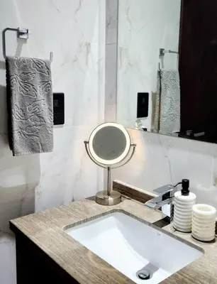 a bathroom with a sink and a mirror at Alaia Retreat in Dubai