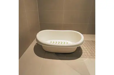 a dog bowl sitting on the floor of a bathroom at Full Seaview Comfortable Apt La Mer Dubai in Dubai