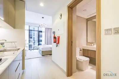 a bathroom with a sink and a toilet in a room at Attractive Studio Apartment in Azizi Riviera 15, Al Merkadh by Deluxe Holiday Homes in Dubai