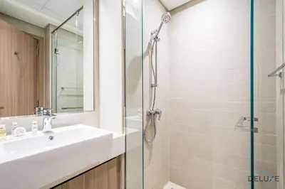 a bathroom with a sink and a shower at Attractive Studio Apartment in Azizi Riviera 15, Al Merkadh by Deluxe Holiday Homes in Dubai