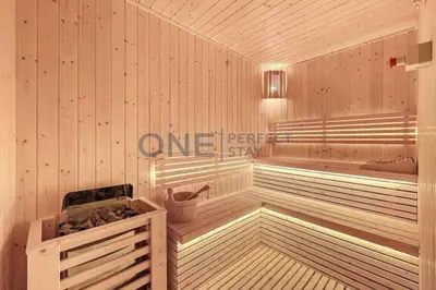 a sauna with a wooden floor and a tub at Studio Chic In Business Bay With Pool and Gym in Dubai