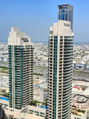 two tall buildings with the word aston on them at 2BD Luxury Opera District Apt Downtown in Dubai