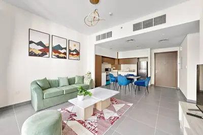 a living room with a couch and a table at Stylish 1 Bedroom High Floor in Creek Edge in Dubai