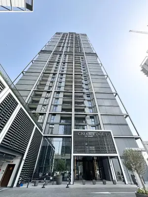 a tall building with a lot of windows at Stylish 1 Bedroom High Floor in Creek Edge in Dubai