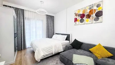 a living room with a bed and a couch at Dubai Marina - Modern Design Studio Apartment, Marina Diamond 2 in Dubai