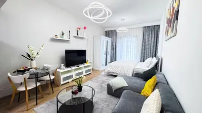 a living room with a couch and a bed at Dubai Marina - Modern Design Studio Apartment, Marina Diamond 2 in Dubai