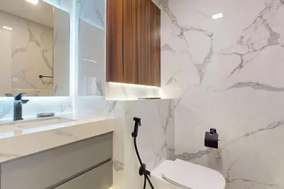a bathroom with a toilet and a sink at Rimal 1 - Opulant Two Bedroom in Dubai