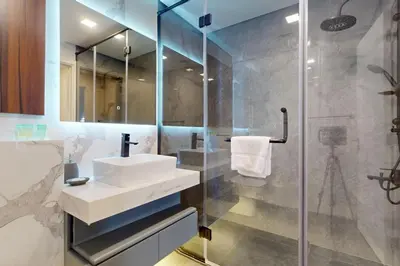 a bathroom with a sink and a shower at Rimal 1 - Opulant Two Bedroom in Dubai