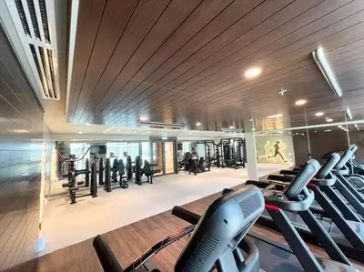 a gym with treadmills and cardio equipment in a building at Elegant 1 bedroom in Creek Edge in Dubai