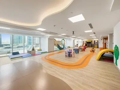 a large room with a slide and a playground at Big Studio - WOW facilities in Dubai