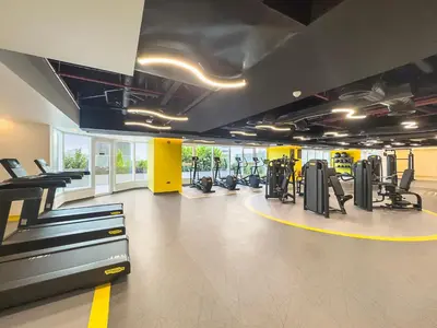 a gym with treadmills and cardio equipment in a building at Big 1BD in JLT - Pool, Game Zone in Dubai