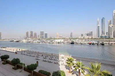 a view of a marina with boats in the water at Silkhaus Large 3BR plus Maid Room Elegant Marina View in Dubai