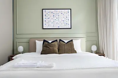 a bedroom with a large white bed with pillows at Silkhaus Large 3BR plus Maid Room Elegant Marina View in Dubai