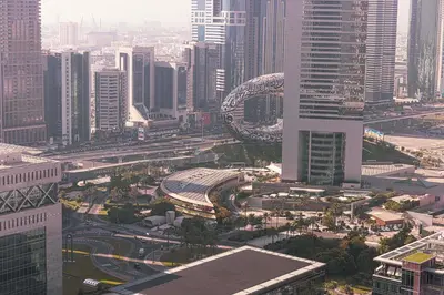 an aerial view of a city with tall buildings at Heart of DIFC 1 BR LUX - Exceptional View in Dubai