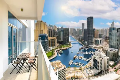 a balcony with a view of a river in a city at LUX The Ultimate Marina View Suite in Dubai
