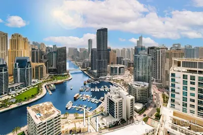 a view of a city with a river and buildings at LUX The Ultimate Marina View Suite in Dubai