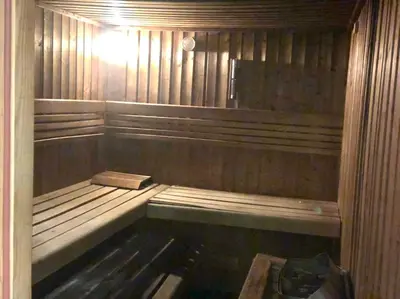 a wooden sauna with a bench in it at Vacation Friendly Beach View Luxury 1Bedroom- Walk To Beach & Mall in Dubai