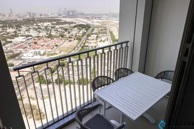 a balcony with a table and chairs and a view at New Stylish 1BR Apartment, Next to Dubai Mall - Downtown Views ll, Tower 3 in Dubai