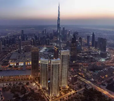 an aerial view of a city at night at Top Floor Urban Oasis Steps from Dubai Mall - 1BR Apartment in Downtown Views ll, Tower 1 in Dubai