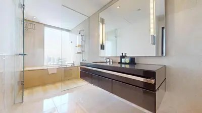 a bathroom with a sink and a mirror at Vacationer l Bright 1 Bedroom l Marina & Yacht Views l Pool access & Free Wi-Fi in Dubai