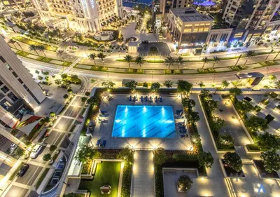 an overhead view of a city at night at Luxurious 2 BR- Dubai Creek Harbour - Host & Stay in Dubai