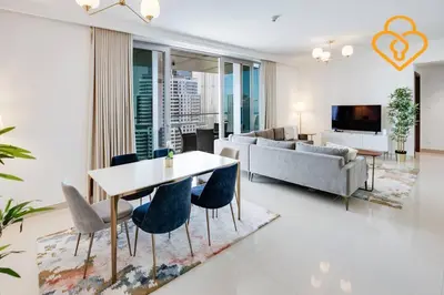 a living room with a table and chairs and a couch at Keysplease 3 BR Burj View, Dubai Mall Access Boulevard Point Tower in Dubai