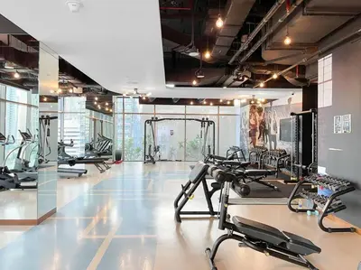 a gym with several treadmills and cardio machines at Marina View 1BR Chic Stay in Dubai Vibrant Walk Near Dining & Attractions in Dubai