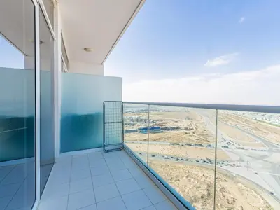 a balcony in a building with a view at Studio in Damac Hills - Modern Comfort with Premium Amenities,by Think Realty in Dubai