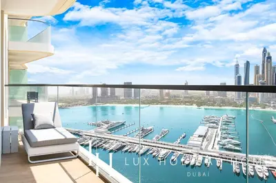a balcony with a view of a marina at LUX The Marina Vista Beachfront Suite 3 in Dubai