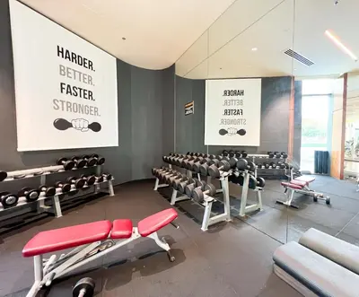 a gym with rows of chairs and a large screen at Stylish 2BR Burj Khalifa & Fountain View Downtown - 37AB06 in Dubai